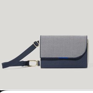 Rothy’s belt bag in navy dog. NWT.